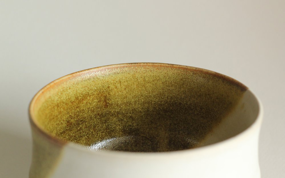 Closeup of mossy green glaze.