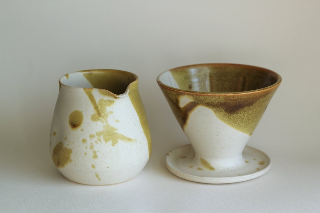 Coffee server and V60-style dripper in white and mossy green glaze.